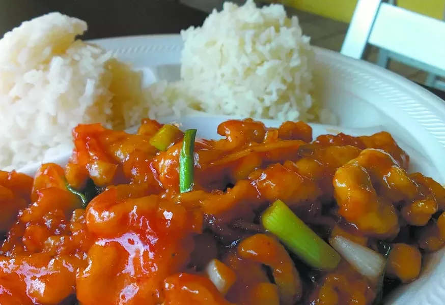 PJ Thai's piping hot Orange Chicken keeps a palate interested with plenty of spicy ginger and green onions. - PHOTO BY TIM RUTHERFORD
