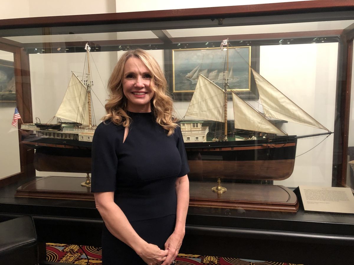 Patti Callahan Henry stands with a model ship March 9 in the Maritime Museum.