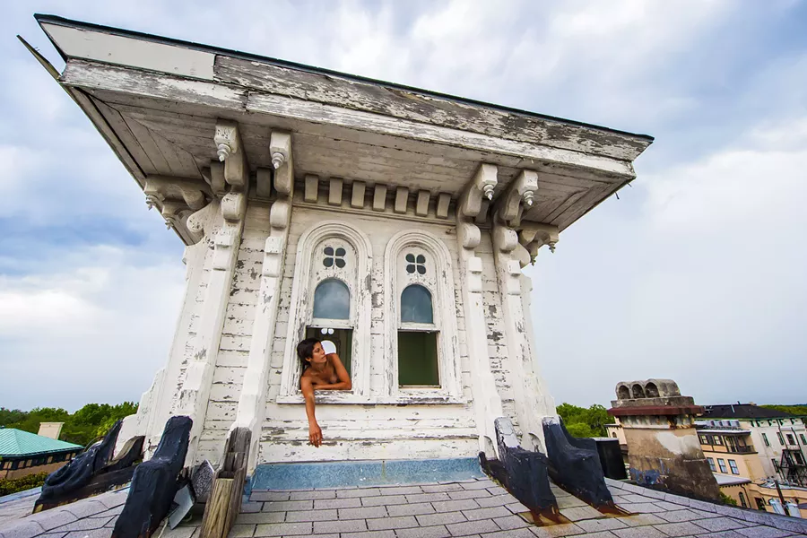"This is on top of what's supposedly the largest residence in downtown Savannah, now an antiques shop. The model is Shabnam Gideon, who's real well-known around town for her work with the Forsyth Farmers Market and farm-to-table-like things. I've known her for a long time. This is a cupola on top of the building. When I was a freshman at SCAD, students rented this entire building. It's so large downstairs, kids would ride their bikes around inside. I remember at one point someone actually rented this cupola and lived in it. They had a little bed tucked in there."