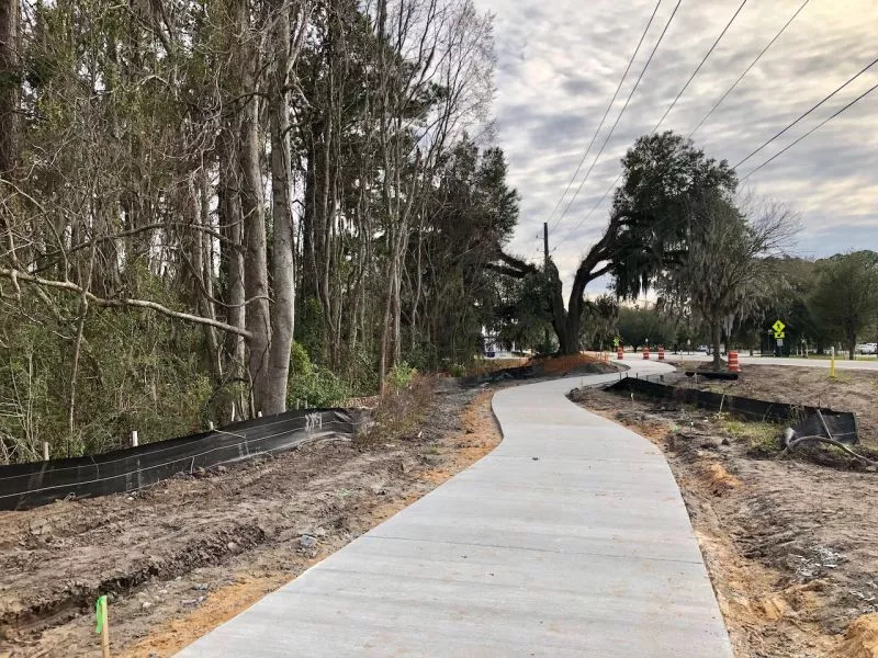 Concrete has been poured on the path of the Truman Linear Park Trail adjacent to Sally Mood Drive. Chatham County is constructing the segment of the trail that runs from Lake Mayer Community Park to DeRenne Avenue.