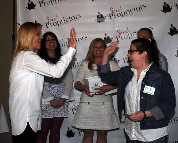 Elizabeth Kaiser of MadLawMedia (r.) high fived her film subject, Fleet Feet’s Cookie Espinoza. - PHOTOS BY WADE MALWITZ