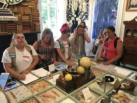 A Girl Scout troop from New Jersey explores the interactive installation, “A Library ReImagined,” at the Juliette Gordon Low Birthplace, also known as “Girl Scout Mecca.”