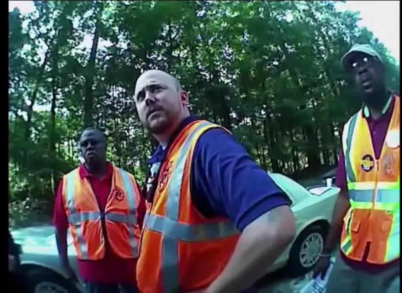 While legally attempting to inform truck drivers of their labor rights, union organizers (l. to r.)Jerome Irwin, Ben Speight and Kedrix Murray were issued questionable citations by an officer who caught the whole exchange on his bodycam.