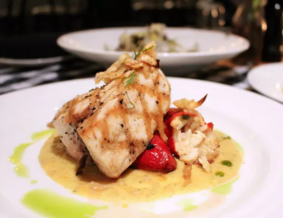 Swordfish steak with sweet piquillo peppers stuffed with crab and rice along with toothsome candied fennel and ripe yellow tomato coulis.