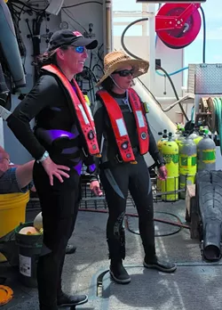Chief scientist Kim Roberson (left) oversees operations and makes twice daily dives to collect data and specimens. - PHOTO BY JESSICA LEIGH LEBOS