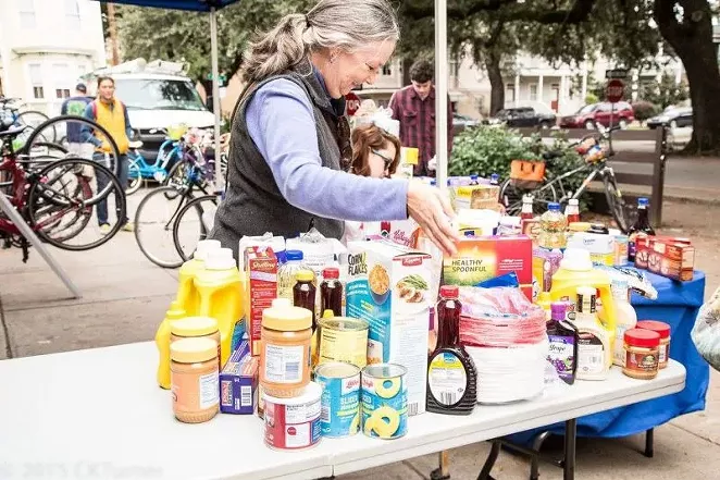 Savannah Bicycle Campaign volunteer Maggie Rickenbaker organizes food at Cranksgiving, a pedal-powered food drive benefiting Emmaus House.
