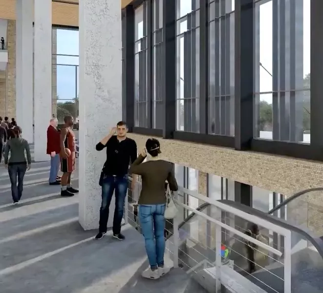 One of the very few African American CGI characters in the video is the man at left, in full basketball uniform, holding a basketball and standing in the Savannah Arena lobby.