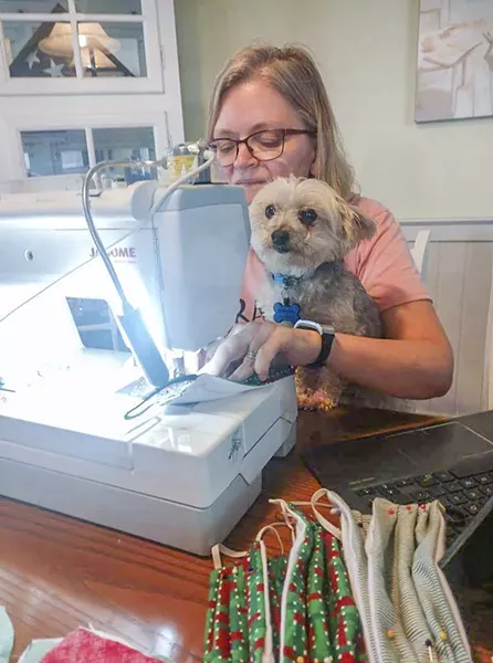Brenda Scarpati and her dog Winston at work.