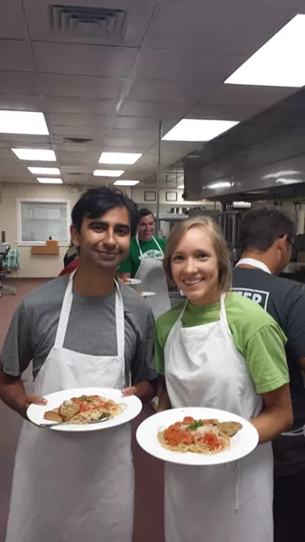 Mercer Medical College students practice in the kitchen.