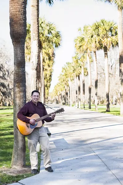 Corbett's passion for the guitar has provided him great solace, he says. - PHOTO BY GEOFF L. JOHNSON