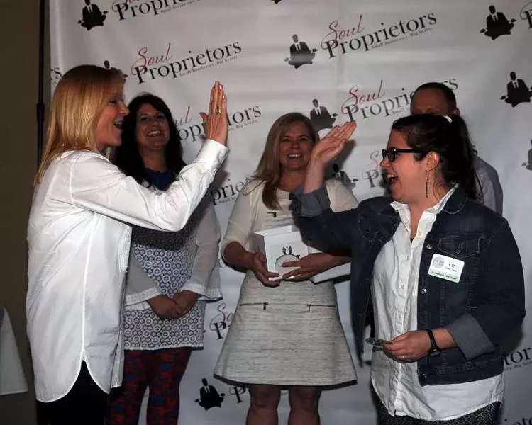 Elizabeth Kaiser of MadLawMedia (r.) high fived her film subject, Fleet Feet’s Cookie Espinoza. - PHOTOS BY WADE MALWITZ