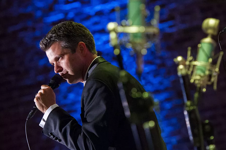 Clay Johnson croons for the crowd. - PHOTO BY GEOFF L. JOHNSON