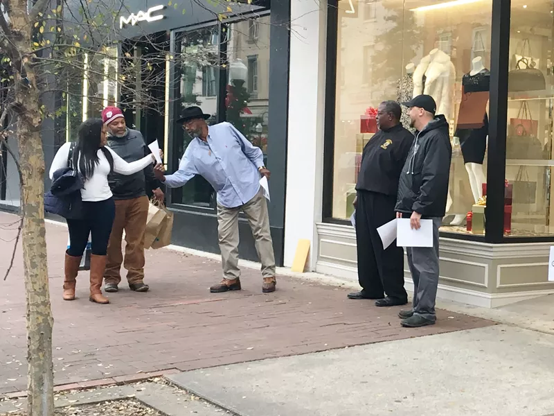Truck driver Richard Ford (l.) handed out leaflets on Broughton Street last week with fellow Teamsters Jerome Irwin (center) and Ben Speight.