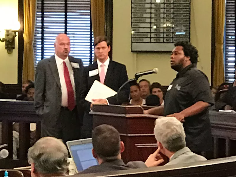 The Stage On Bay owner Charlie Schmitt stands with attorney Will Claiborne as West Savannah resident Charles Brown speaks in support of the project at today's City Council meeting.