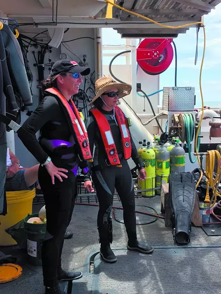 Chief scientist Kim Roberson (left) oversees operations and makes twice daily dives to collect data and specimens. - PHOTO BY JESSICA LEIGH LEBOS