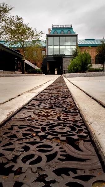 A good view of the unique 'glass tower' installation in the main building; at foreground is a stylized trench drain. - PHOTO BY JAMES BYOUS