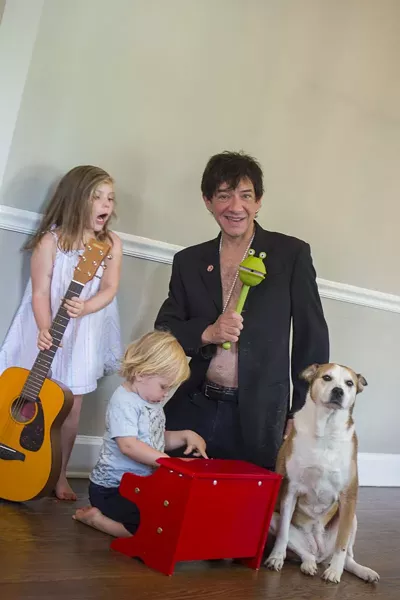 Keith with his children, Zeila and Wolfgang, and the family pup. - GEOFF L. JOHNSON