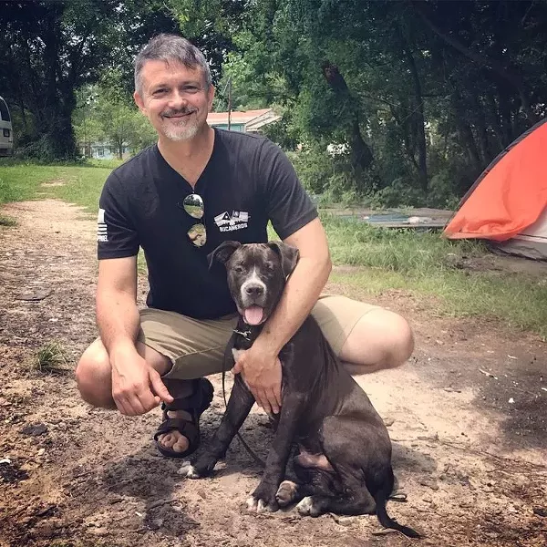 The author with Boss, aka "Jimbo" at Pritchard 2 - PHOTO COURTESY COASTAL PET RESCUE/JULIA SCHAAF