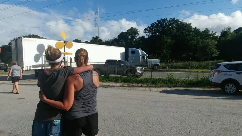 #SAVforLA co-conspirators Crystal Brooks and Courtney Rawlins watch the supplies head out.