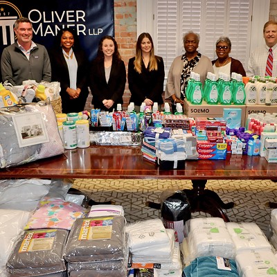 Giving back: Oliver Maner presents donations from Women’s Emergency Housing Center supply drive