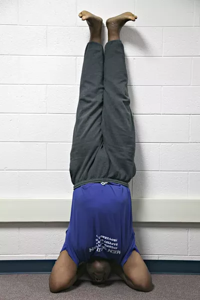 Yoga headstands are not for everyone and should be performed with the guidance of a certified yoga instruction. For Reginald Franklin, the headstand and other yoga postures improve strength, confidence, and balance.