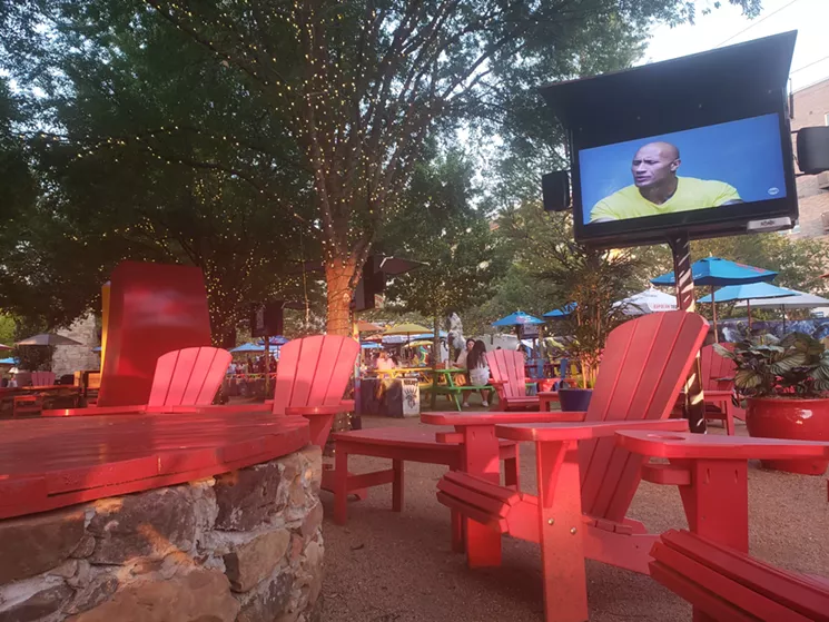 The spacious courtyard has all the necessary amenities like TVs, fire pits, laid-back chairs and The Rock. - KRISTINA ROWE