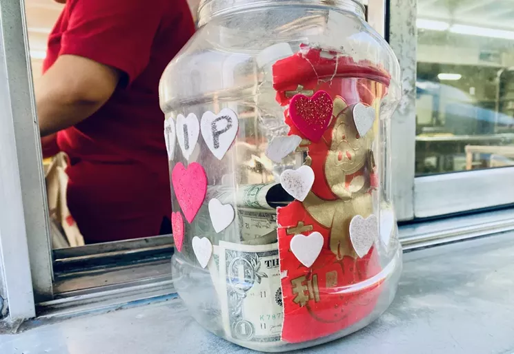 Felt hearts glued to a repurposed jug along with other personable bling is the less-aggressive ask. - LAUREN DREWES DANIELS