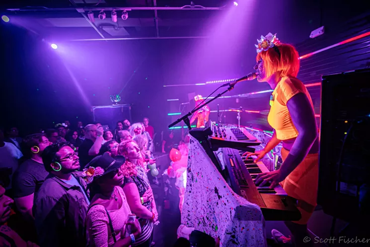Poppy Xander playing with Helium Queens with their signature black lights and neon attire. - SCOTT FISCHER