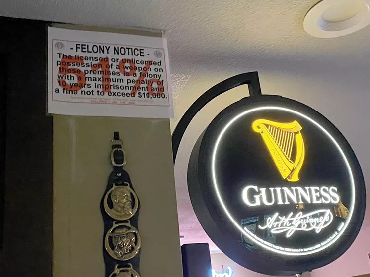 This red "51%" sign still applies to bars and prohibits any guns on the property. - LAUREN DREWES DANIELS