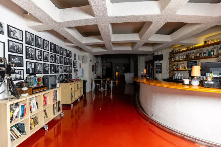 The Texas Theatre's construction project also included some renovations to the first floor like the new, red signature floor in the main bar and waiting area. - KATHY TRAN