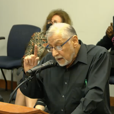 Dallas College professor Richard Menchaca addresses board members on Nov. 9.