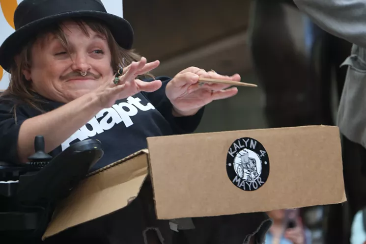 Rapper Kalyn Heffernan conducts a group of musicians protesting at the Denver Performing Arts Complex in 2019. - KYLE HARRIS