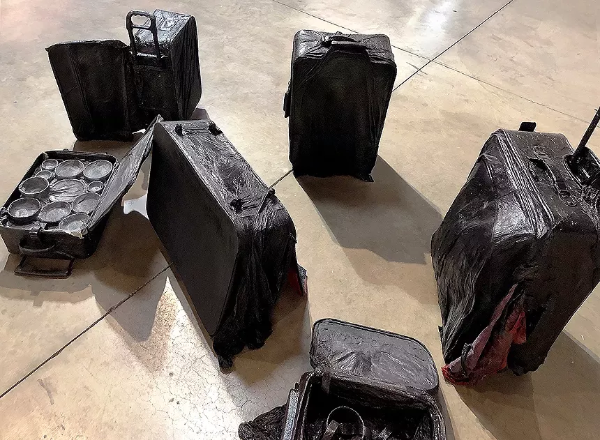 Sammy Lee, "FOB Arrived," ongoing series since 2017, eleven various sized suitcases, hanji (Korean mulberry paper), acrylic varnish. - SAMMY LEE,