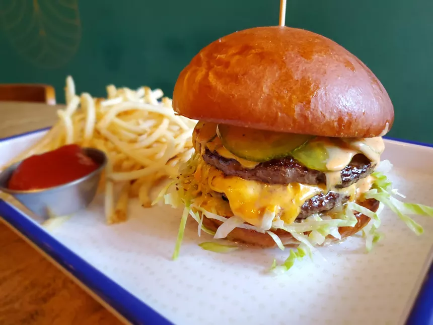 The happy hour version of the burger at Brass Tacks is a single patty, but it has all the flavor of the full size variety. - MOLLY MARTIN