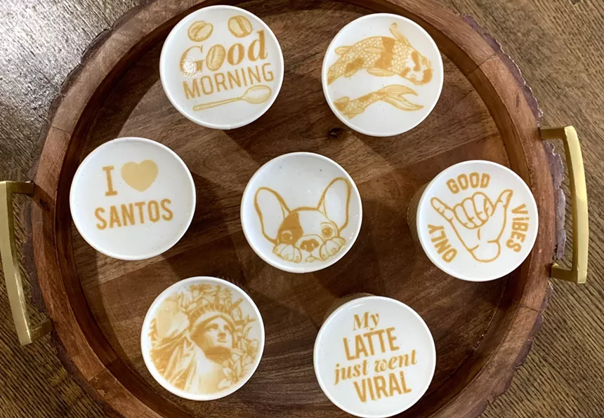 A variety of latte foam art at Santos Café and Grill, including the very popular puppy selection. - STACI BERRY