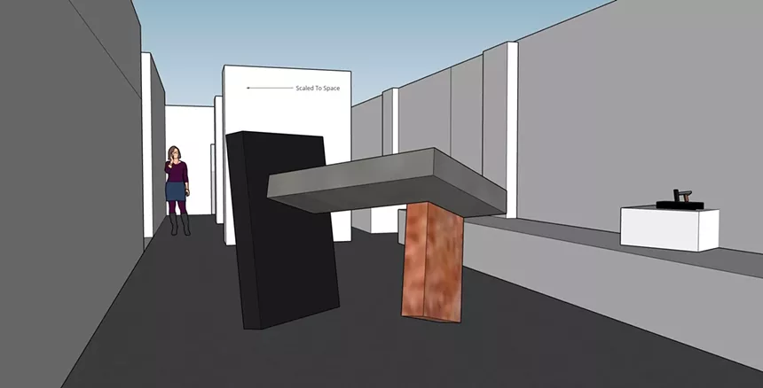 Virginia T. Coleman compares preliminary art sketches and the culminating metal sculptures at Next Gallery. - VIRGINIA T. COLEMAN