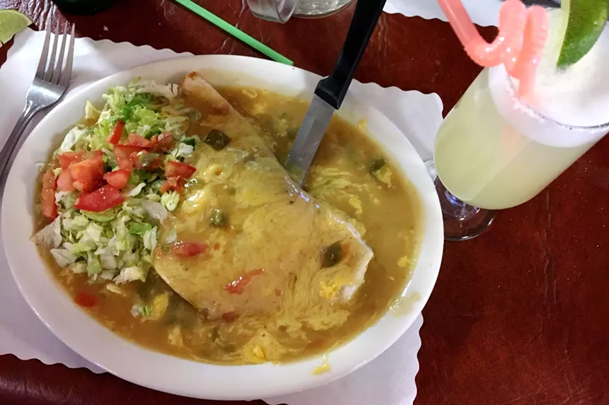 The Mexican hamburger at La Fiesta, served with spicy, stick-to-your-ribs green chile. - MARK ANTONATION