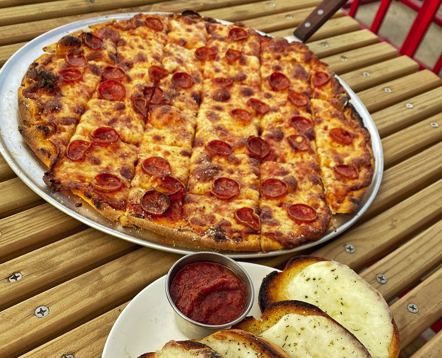 The thin crust, Chicago tavern-style pies at Grabowski's are cut into square slices. - GRABOWSKI'S PIZZERIA/FACEBOOK