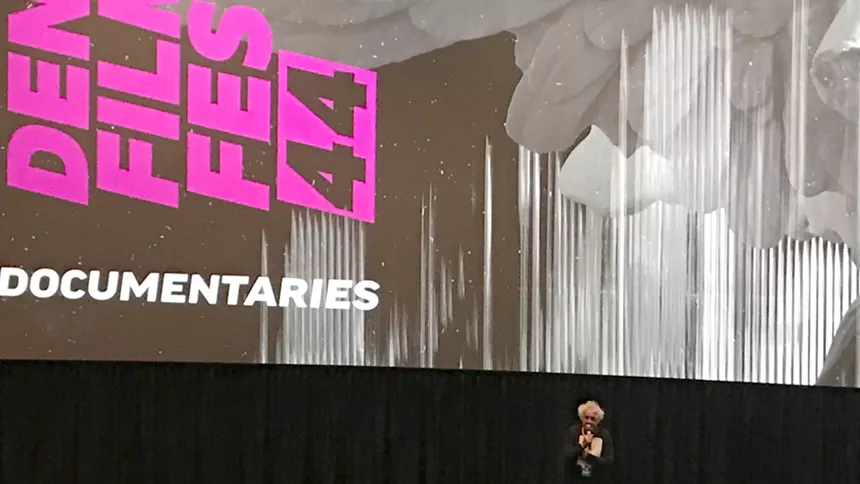 That's Denver Film Festival co-founder Ron Henderson in front of the big screen at AMC 9 + CO 10 prior to a screening for The Taking. - PHOTO BY MICHAEL ROBERTS