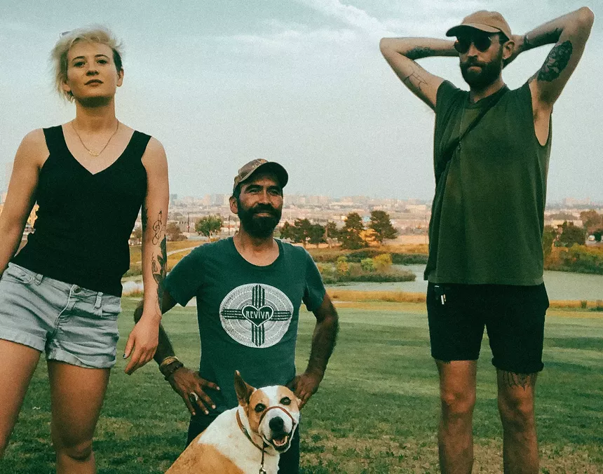 Melanie Steinway, Art Heffron and Andrew Bair along with Steinway's dog, Django, at Barnum Park near their house. - MELANIE STEINWAY