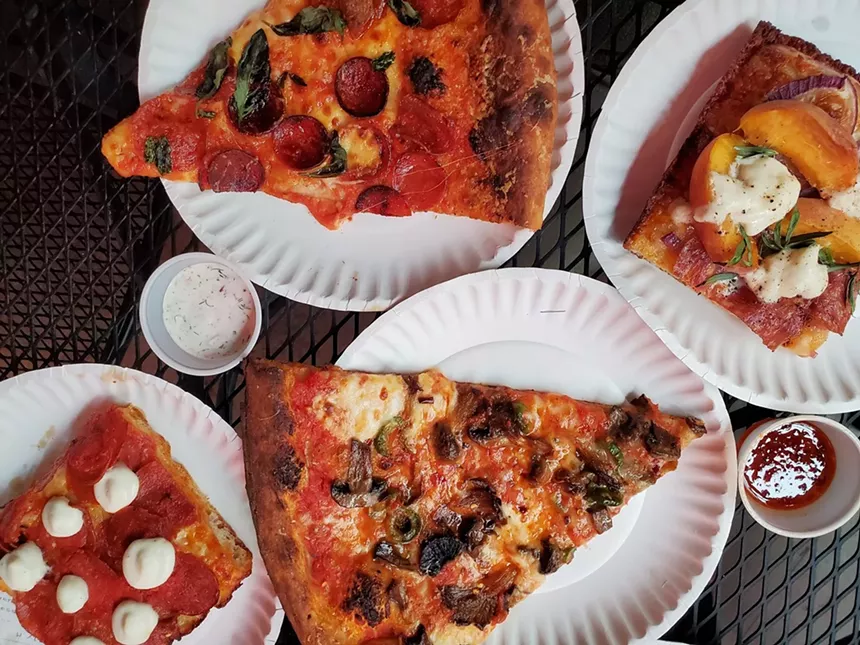 You can order from the slice window or get a table in the dining room at Redeemer Pizza. - MOLLY MARTIN