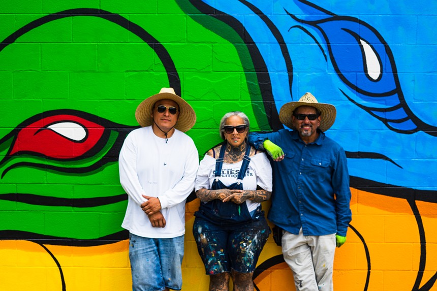 Artists Victor J. Escobedo (from left), Alicia Cardenas and Marco Antonio Garcia in front of their collaborative piece "Xipe Totec." - ANTHONY MAES