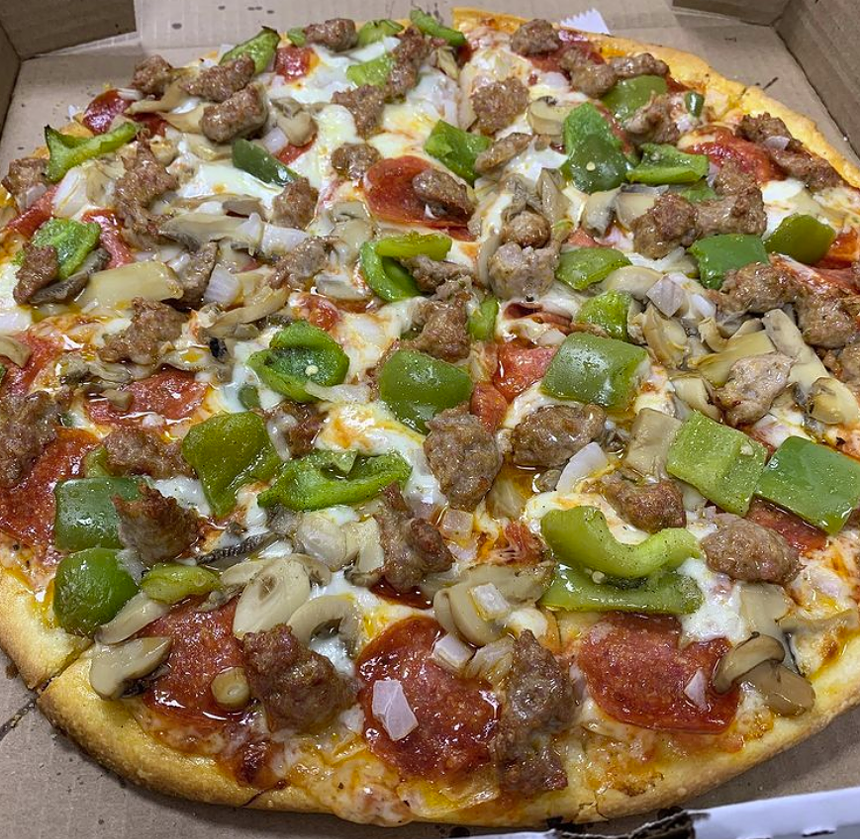 The Special Romano Pizza with sausage, mushrooms, pepperoni, oven-roasted green peppers and onion. - PIZZERIA DE ROMANO / INSTAGRAM
