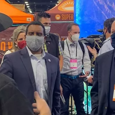 Governor Jared Polis and Congressman Joe Neguse masked up during an August 10 visit to the Summer Outdoor Retailer Show at the Colorado Convention Center.