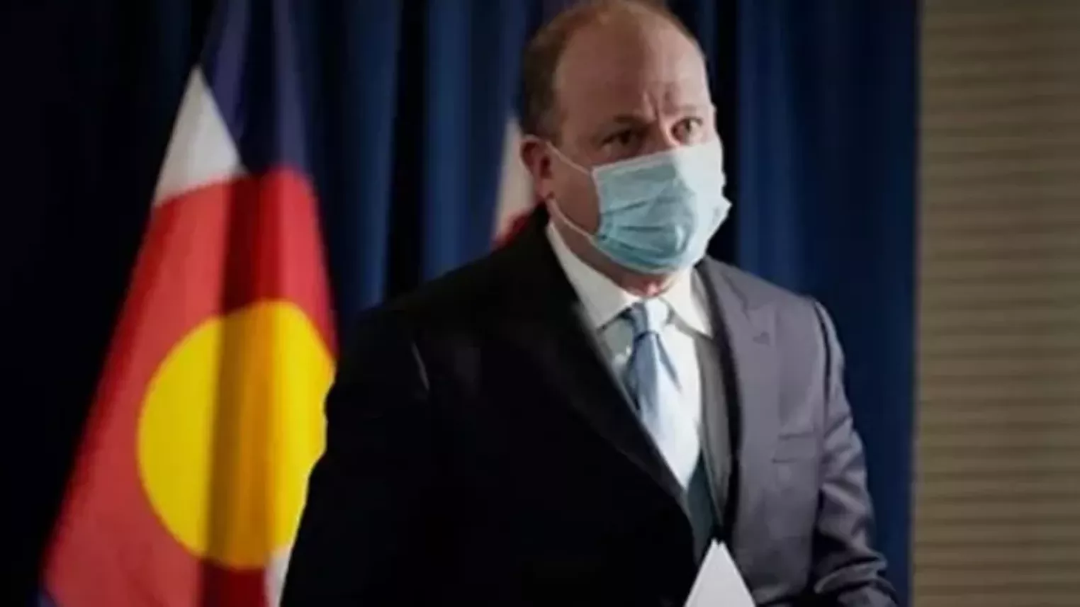 Should Children Lie and Receive COVID Vaccine without Parents Knowing? 4 jared.polis.9news.standing.masked.youtube 1