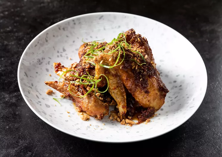 Viet-Cajun Confit Chicken Wings are a hint at the fusion fare of Georgia James Tavern. - PHOTO BY JULIE SOEFER