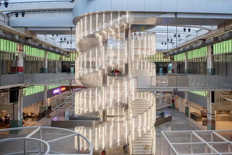 A lighted spiral staircase is a stunning centerpiece. - PHOTO BY KAT AMBROSE