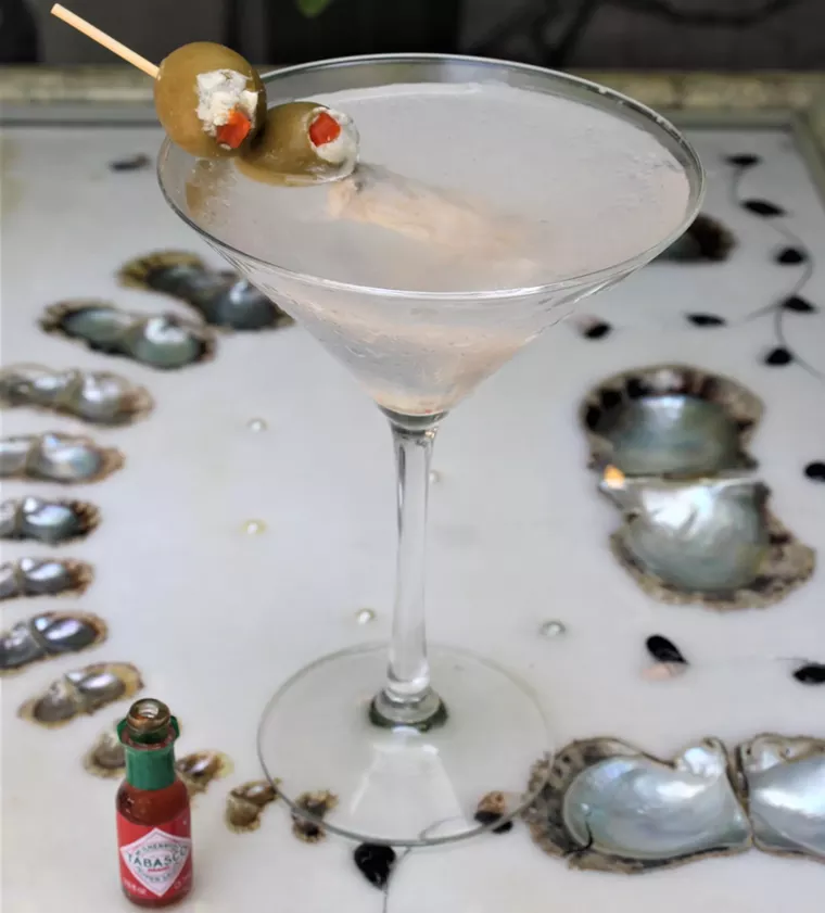 Shaken, not stirred, with a chilled oyster, two olives. - PHOTO BY ADAM DINARI
