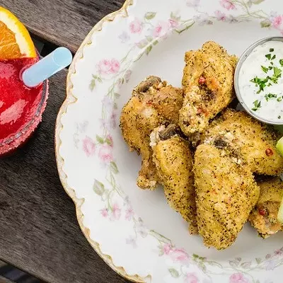 A frozen Negroni and chicken wings are a perfect treat on the patio.