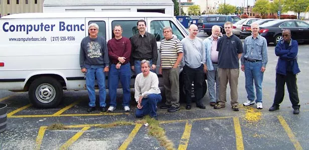Computer Banc volunteers standing, left to right: Mike Fahsl, Bob Pietras, Lou Gianasi, David Rowell, Cody Colburn, Jim Suttie, Matt Hagaman, Ron Hagaman and Dwayne D. Coleman. Kneeling is Fred Carter. - PHOTO BY ERICKA HINE